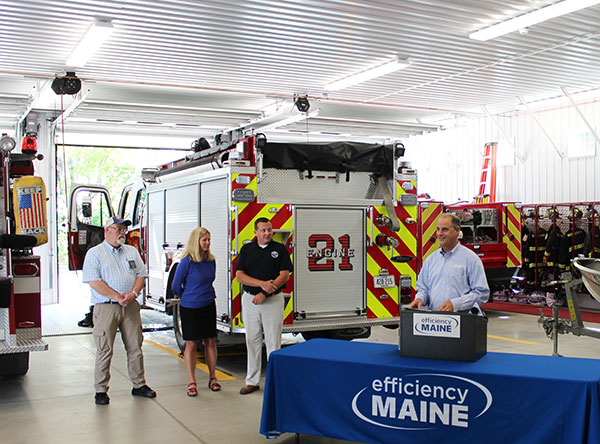Efficiency Maine executive director Micael Stoddard speaking at a fire department.