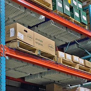 Shelving units in a storage facility covered with boxes.